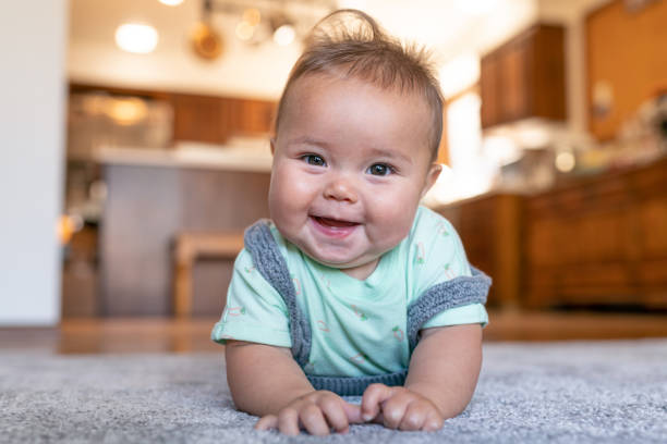 Cute baby on carpet floor | Cherry City Interiors