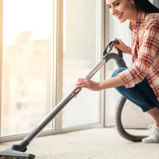woman-cleaning-carpet | Cherry City Interiors and Design